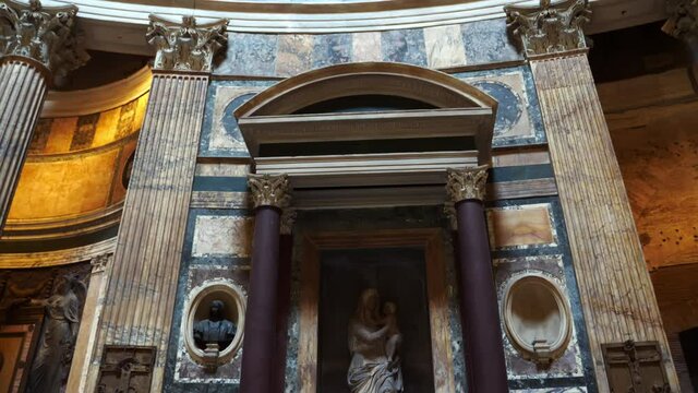 Statue of the Virgin with child and tomb of Raphael Santi in the Pantheon one of the tourist attractions in the center of Rome