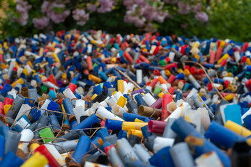 Many colorful spent shotgun shells displayed in front of a shooting range in the UK. Many different...