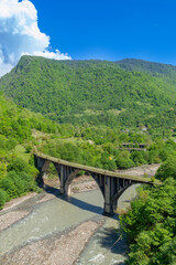 Abkhazia. Abandoned railway bridge over the river Alxga. Attraction of the abandoned city of Tkuarchal (Tkvarcheli).
