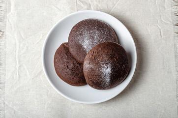 Chocolate biscuits with powdered sugar. High quality photo