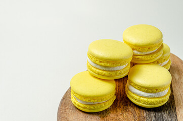 passion fruit pasta cookies.Yellow multi-layer cookies with filling on a wooden stand High quality photo