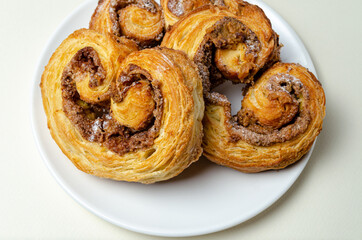French sweet bun. On a white plate High quality photo