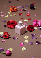 buttercup flowers and cosmetic bottle on brown background.