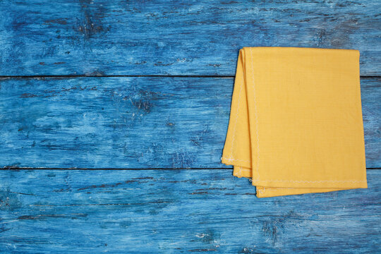 Yellow napkin on blue boho table