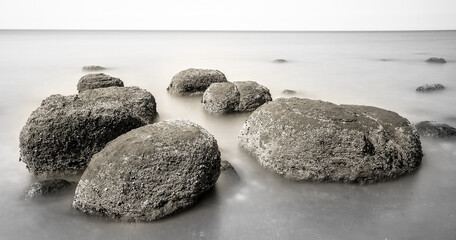 Boulders on smooth sea