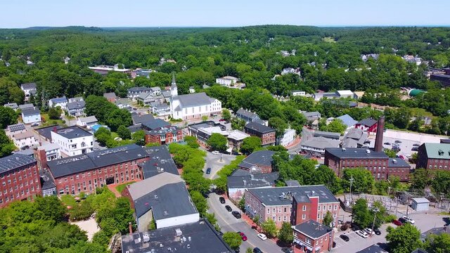 Amesbury historic downtown aerial view on Main Street including Market Square, Market Street Baptist Church and historic mill buildings in city of Amesbury, Massachusetts MA, USA.  