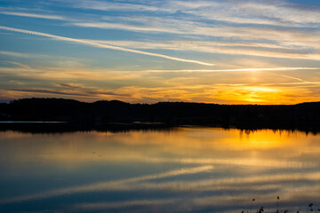 Beautiful colored sunset over a calm lake
