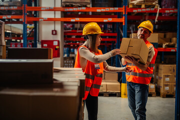 Man and woman working together in a warehouse