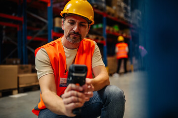 Warehouse woman worker with bar-code scanner