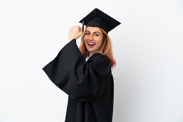 Young university graduate over isolated white background celebrating a victory