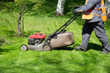 Lawn Mower. Municipal services are engaged in mowing lawns.