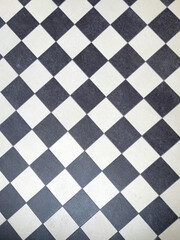 a black and white chess pattern of a floor
