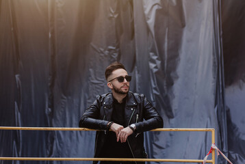 man in sunglasses and leather jacket