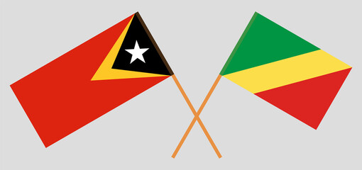 Crossed flags of East Timor and Republic of the Congo. Official colors. Correct proportion