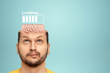 In the man's head is an image of the brain and a loading scale. Concept for education, reading,...
