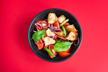 panzanella salad tomato, croutons, onion, olive oil, rusk on the table healthy food meal snack copy space food background rustic. top view keto or paleo diet veggie vegan or vegetarian food