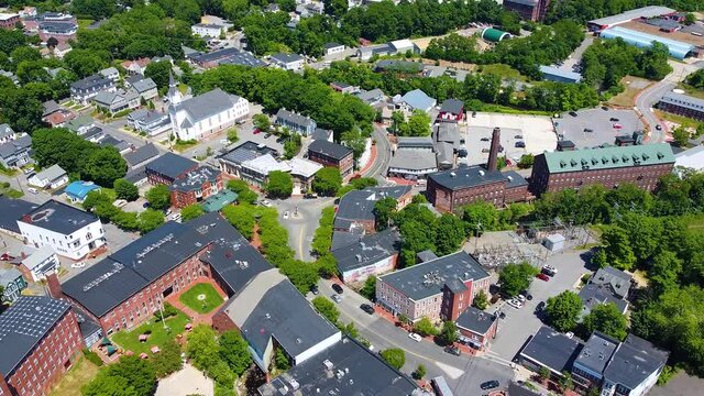 Amesbury historic downtown aerial view on Main Street including Market Square, Market Street Baptist Church and historic mill buildings in city of Amesbury, Massachusetts MA, USA.  