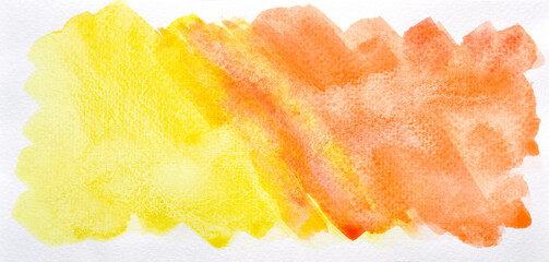 a photo image of abstract orange and yellow watercolor on paper, hand paint of orange and yellow watercolor gradient for background, wet technique on paper to mix difference color