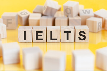 word IELTS written on wood blocks, education concept