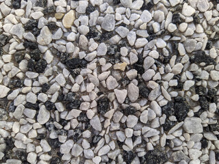 very small black and gray stones closeup photo