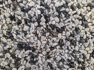very small black and gray stones closeup photo