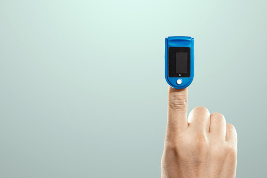Pulse oximeter, digital device for measuring blood oxygen saturation and pulse rate on the finger. Medical research, close-up.