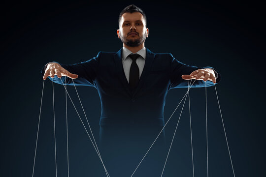 The Human Hand with Marionette on the Strings. Stock Image - Image