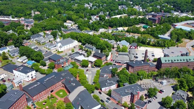 Amesbury historic downtown aerial view on Main Street including Market Square, Market Street Baptist Church and historic mill buildings in city of Amesbury, Massachusetts MA, USA.  