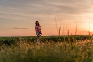 Beauty young girl outdoors enjoying nature, sunset