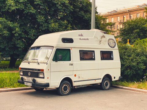 St. Petersburg, Russia - July 3, 2020: Classic old camper van blue color Volkswagen LT35 for travel parked in city street. 