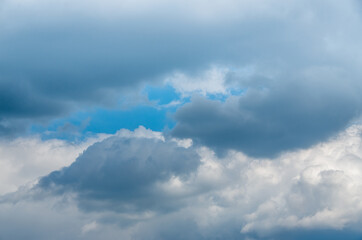 View into impressive spring sky with thick clouds as a texture or background