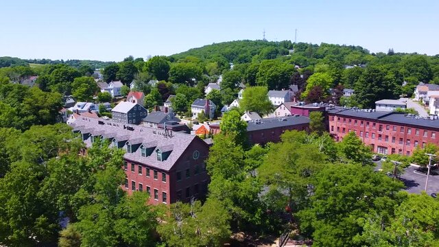 Amesbury historic downtown aerial view on Main Street including Market Square, Market Street Baptist Church and historic mill buildings in city of Amesbury, Massachusetts MA, USA.  