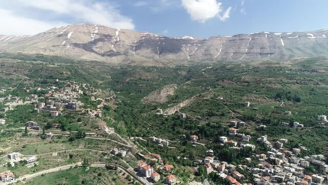 Beautiful village near the valley. Aerial footage of the city and valley. Best hiking trails. Middle East region. Summer vacation in Lebanon. Mountain trip. Village and valley view