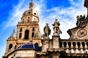 Tower bell, sculptures and carved stone details of the Cathedral of Murcia