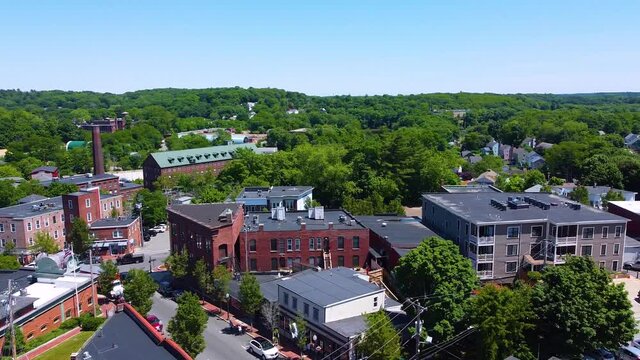 Amesbury historic downtown aerial view on Main Street including Market Square, Market Street Baptist Church and historic mill buildings in city of Amesbury, Massachusetts MA, USA.  