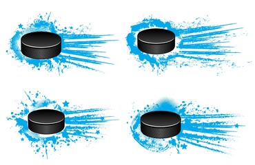 Ice hockey pucks vector design with winter sport game player equipment. Black rubber pucks on grunge blue background of ice rink with paint splashes, halftone pattern, motion trails and stars