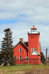 Fototapeta na wymiar red lighthouse on the coast