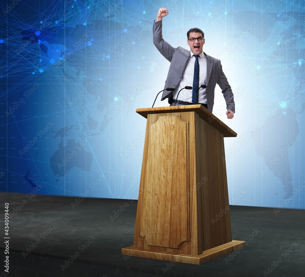 Wall mural Man businessman making speech at rostrum in business concept