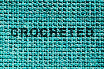 Knitted blue background, an example of knitting from a polymer cord using the crochet technique with a single crochet.