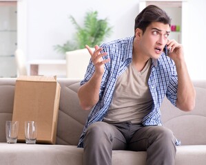 Man receiving wrong parcel with glasses
