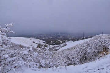 Fototapeta premium Little Black Mountain Peak hiking trail snow views winter via Bonneville Shoreline Trail, Wasatch Front Rocky Mountains, by Salt Lake City, Utah. United States.