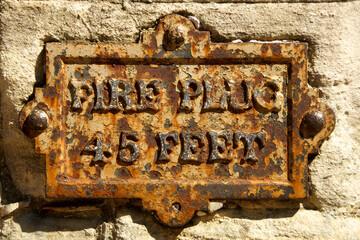 Old rusted “Fire Plug” location metal plate, Windsor Castle, United Kingdom 