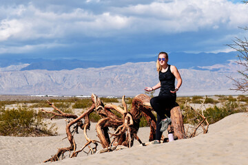 A family with a teenage girl is hiking in Mesquite Flat Sand Dunes, Death Valley National Park,...