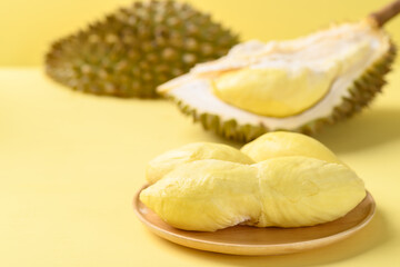 Ripe Thai durian fruit (Monthong) on yellow background, Tropical fruit