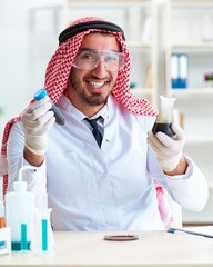 Arab chemist scientist testing quality of oil petrol