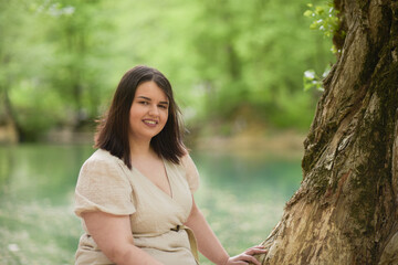 Young girl with a beautiful smile in nature