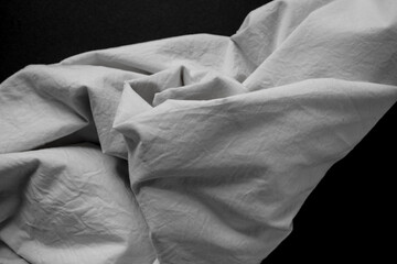 black and white or grey cotton blend fabric - photographed from above with low or raking light -...