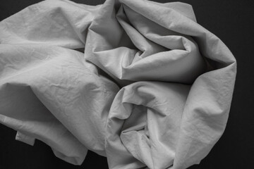 black and white or grey cotton blend fabric - photographed from above with low or raking light -...