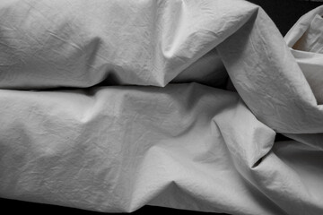 black and white or grey cotton blend fabric - photographed from above with low or raking light -...