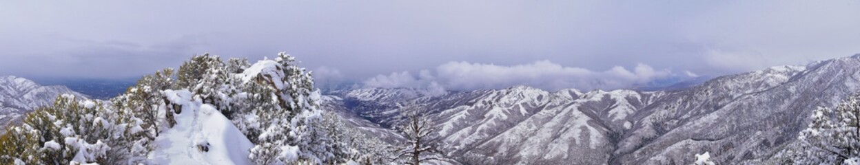 Fototapeta premium Little Black Mountain Peak hiking trail snow views winter via Bonneville Shoreline Trail, Wasatch Front Rocky Mountains, by Salt Lake City, Utah. United States.